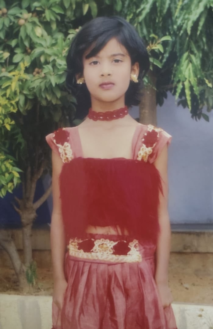 Sneha as a young girl